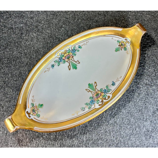 Hand painted floral design trimmed in gold. Marked WA Pickard and Noritake Nippon to underside.