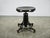 An elegant adjustable bentwood piano stool from Czechoslovakia, dating to the 1930s, featuring a sculptural black-finished...