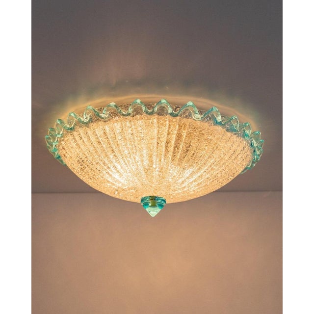 High-quality ceiling chandelier, which is attributed to Barovier e Toso. The hand-blown Murano glass shade, semi-circular...