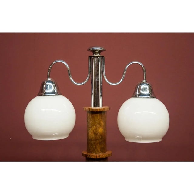 A beautiful table lamp from the mid-20th century in the Art Deco style. The style is characterized by simple design,...