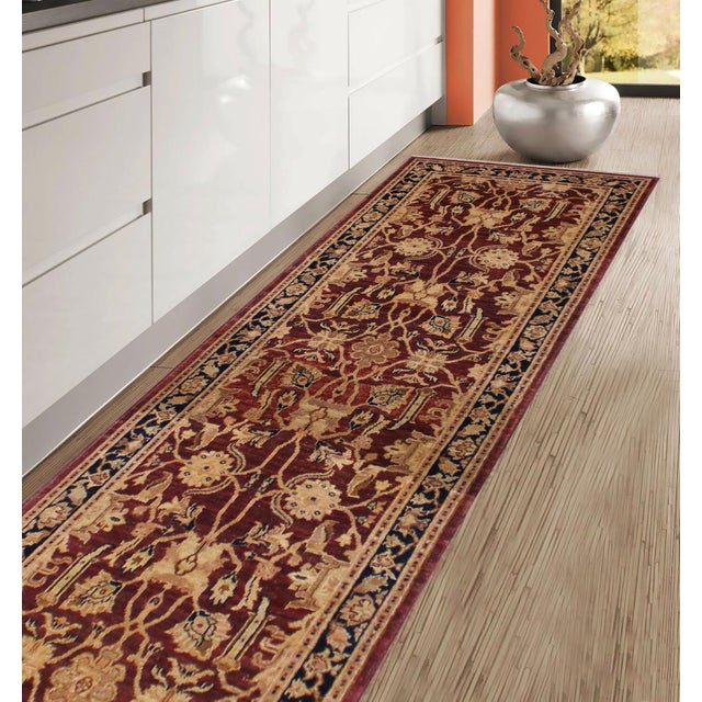 Enhance the ambiance of your home with this magnificent Persian-influenced Turkish hand-knotted rug made by skilled...
