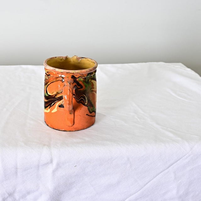 This 19th century jaspé ware ceramic French pitcher from the region of Savoie makes an exciting vase or stand alone décor...