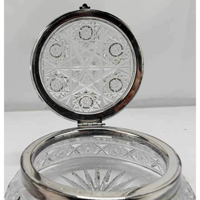 This is a late 19th to early 20th-century cut crystal and silver-plated vanity or dresser box, characterized by an...
