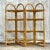 A fantastic vintage Costal wrapped rattan etagere. Beautiful arched design in a chic folding frame. Inset shelves that...