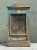 Crafted with a simple, utilitarian silhouette, this vintage rustic cabinet features a wire mesh screen front door topped...