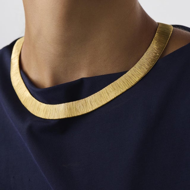 This elegant vintage diamond choker necklace is a bold 1970’s design, crafted in rich 18k yellow gold with a sleek flat...