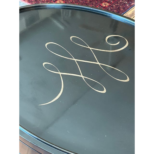 Two oval black lacquer side tables with pull out surface by Barbara Barry for Baker. Just refinished and beautiful....
