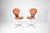 A rare and striking pair from one of postwar Germany's most celebrated furniture makers. These swivel chairs capture...