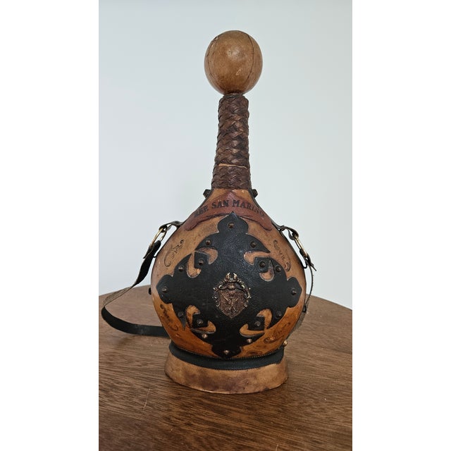 A vintage Italian decanter in glass covered with genuine leather. Initially purchased in the Rep. of San Marino. A great...