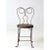 Antique twisted iron bistro chair featuring a sculptural silhouette and warm wood seat that highlights its handcrafted...