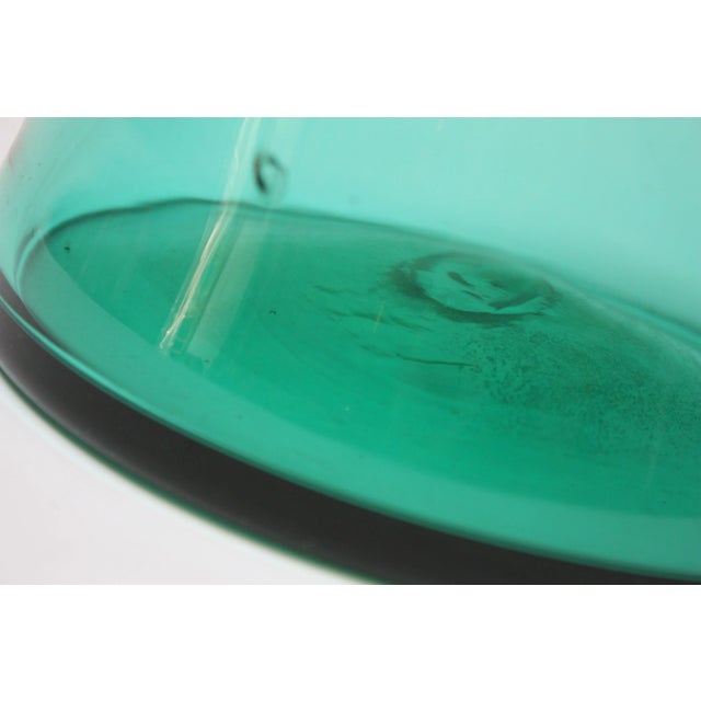 Large blown glass pitcher by Winslow Anderson for Blenko (Model #976) designed between 1962-1963. Fantastic light teal...