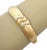 The Darnlaion 18k Two Tone Gold Hinged Dome Bangle Bracelet is a vintage piece of fine jewelry that exudes elegance and...