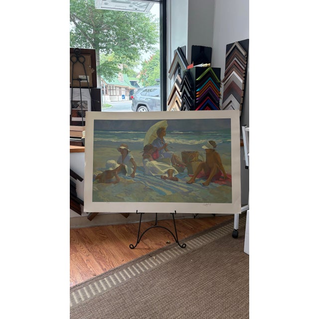 Lovely modern impressionist beach scene of a family on vacation at the beach. Printed by the famous Colville Publishing co...