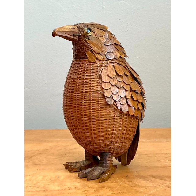 Intricately handwoven by Shanghai Weave with remarkable folk-art craftsmanship, this vintage rattan bird sculpture depicts...