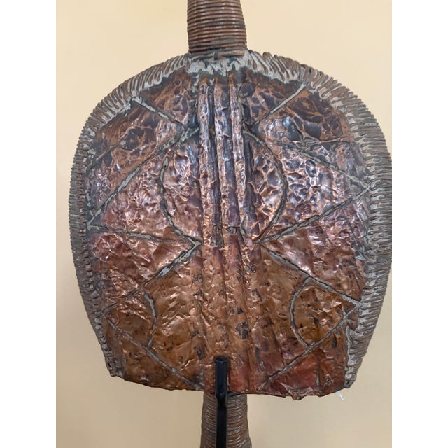 African Kota Reliquary figure from Gabon. From the 20th century. It is made from wood, brass and copper. It has signs of...