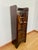 A remarkably slender antique glazed bookcase with the kind of warmth and character that can quietly transform a room....