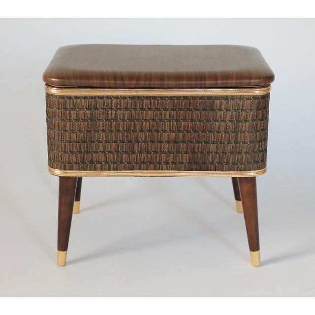 Mid-century brown sewing basket / stool with tapered wood legs and gold tone accents. Hawkeye by Burlington. Some expected...