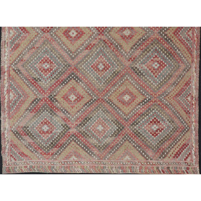 Measures: 7'1 x 11 Vintage Turkish Kilim Rug in Red, Beige, and Olive Diamond Pattern 7'1 x 11'0. Keivan Woven Arts /...