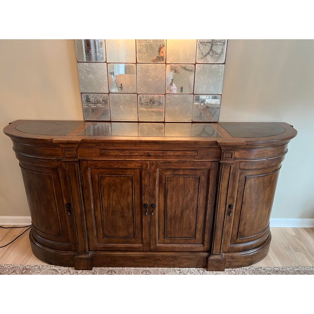 Hooker Archivist sideboard. Stunning piece of pecan veneers and bluestone top. Distressed finishes with antique inspired...