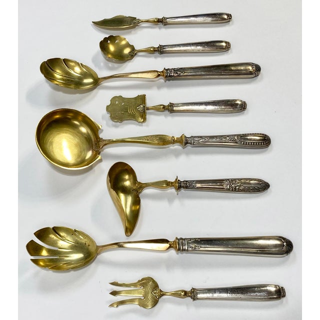 Antique French hors d'oeuvres set of eight (8) pieces featuring handles in Repoussé sterling silver in a classical design....