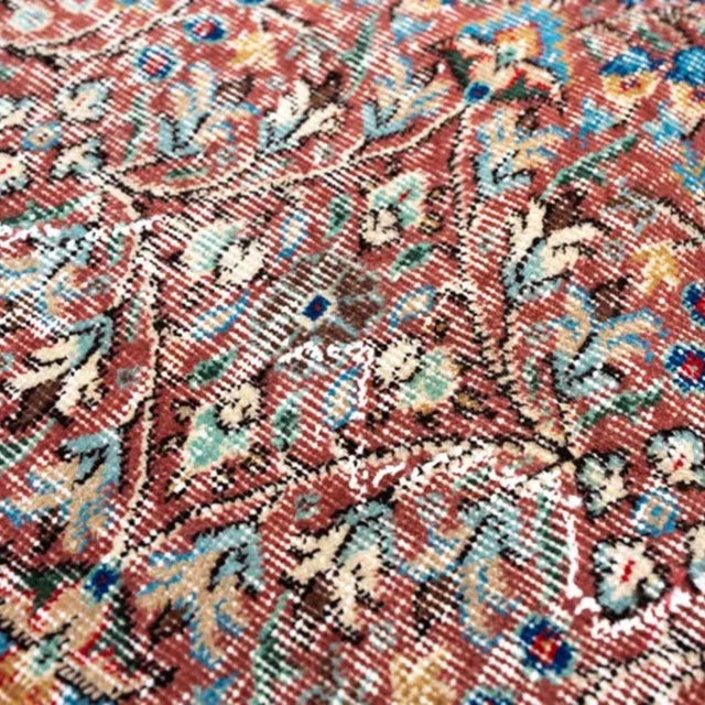 This is a hand-knotted Turkish Sparta (Isparta) rug from the 1960s in a Persian Kerman-style all-over floral design....