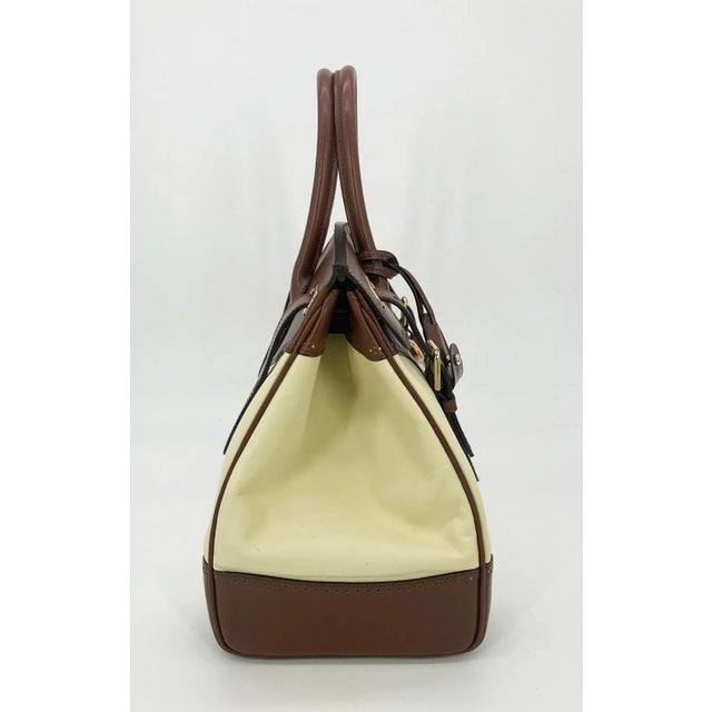 Ralph Lauren Cream and Brown Leather Rickey Bag in good condition. Cream leather body trimmed with brown leather and gold...