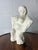 An expressive and tactile hand-built plaster sculpture depicting a stylized female form. This piece celebrates the "divine...