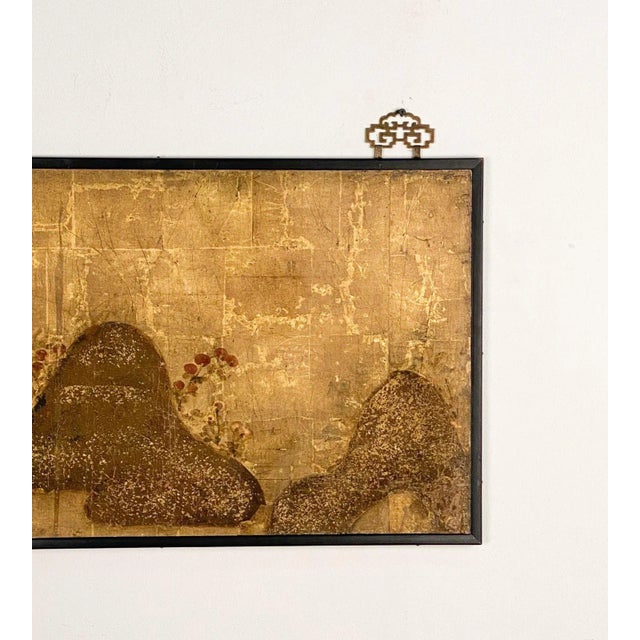 An early Edo Period fragment of a painting, Japan circa 1700, later framing. The scene depicts mountains and trees on a...