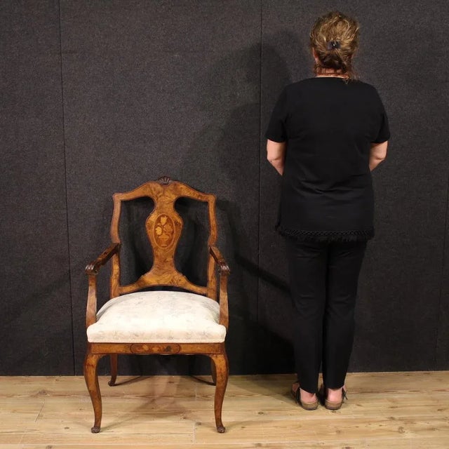 Italian armchair from the mid-20th century. Finely inlaid furniture with floral decoration on the backrest, veneered in...