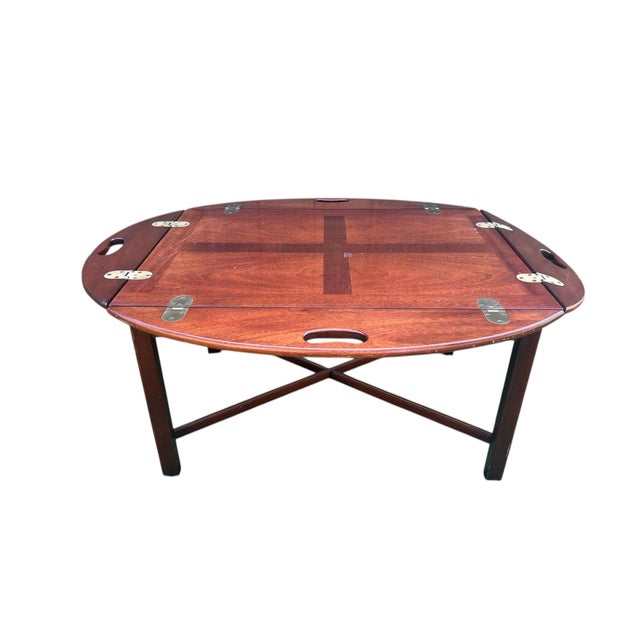 A lovely vintage Butler style coffee or occasional table with brass hinges. Dating from the mid-late 19th century....