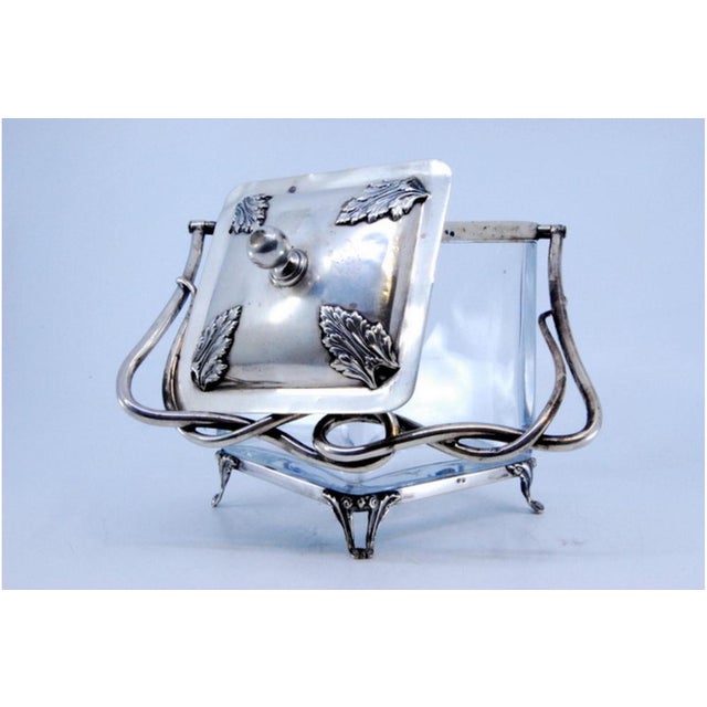 Silver and Glass Candy Box with Palms Decorated Lid, in Very Good conditions. Designed 1890 to 1919 This piece has an...