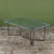 Dining table in patinated bronze designed by Walter Lamb and produced by Brown Jordan. The table has a rectangular shape...