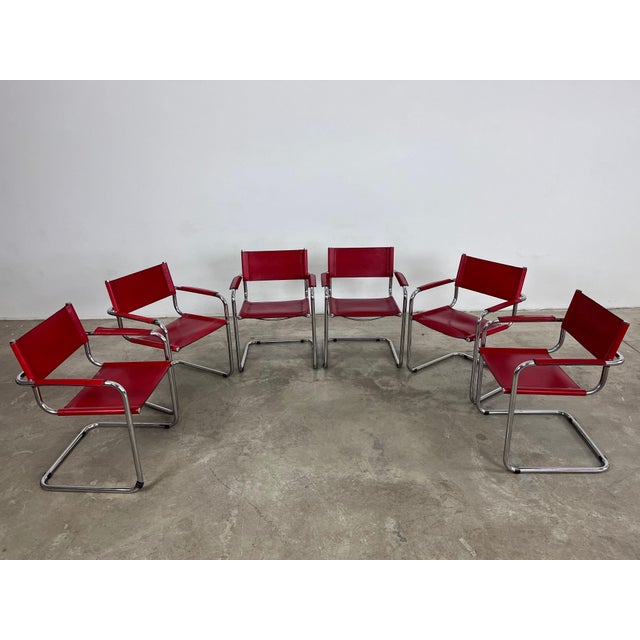 Dimensions: H 30” x W 23.3” x SD 14.5” x SH 17.7” Set of 6 Vintage cantilever chairs manner of Mart Stam in red leather....