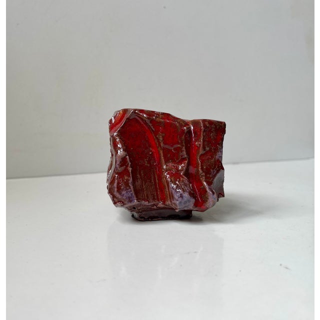 Icelandic studio piece executed in free-form red-clay. Vibrant red blood glaze with purple/brown accents infused with...