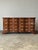 This eight-drawer vintage dresser has a rich mahogany tone and a classic Georgian block-front shape, with a serpentine...
