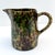 This charming small pitcher from Illinois Morton Pottery features a distinctive spongeware design in rich woodland green,...