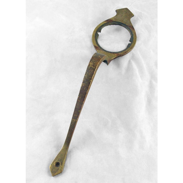 Original brass door pull with a cylinder lock insert. The original mounting screws are not available. Good condition with...