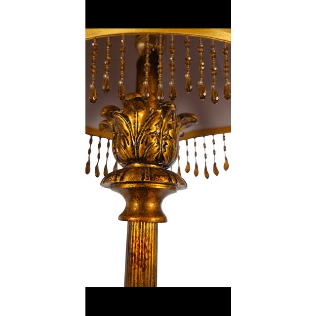 An exceptionally elegant and stately matching pair of vintage Hollywood Regency "Florentine Revival" candlestick buffet...