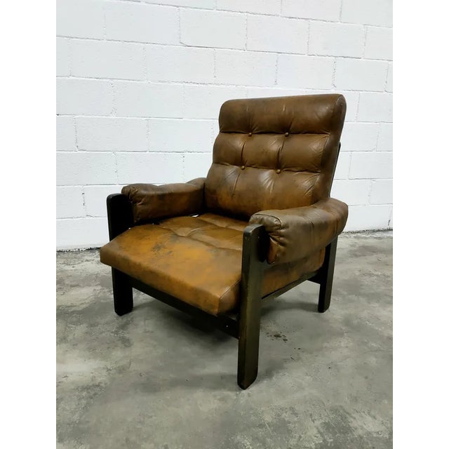 Two genuine leather armchairs in good condition, with a very special patina from the passage of time, manufactured in the...