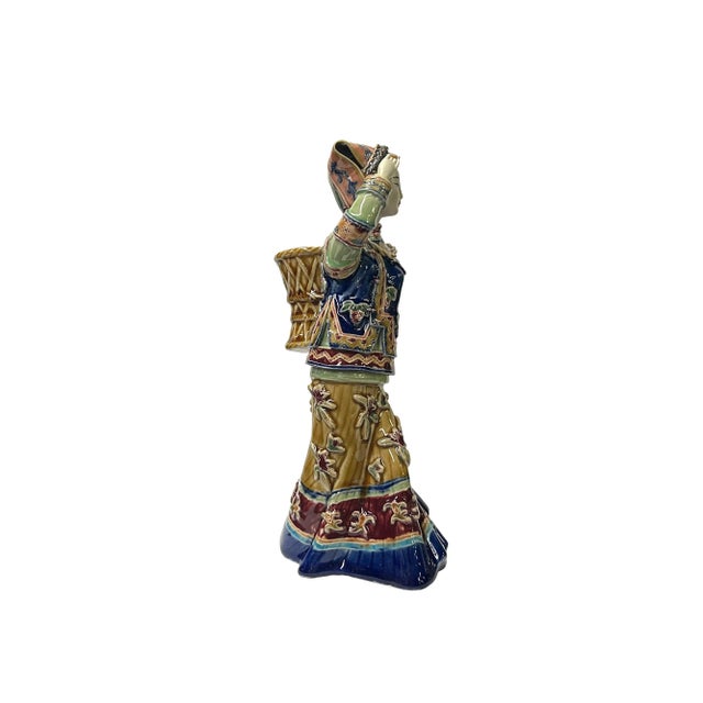 This Chinese Qing style dressing lady figurine is a beautiful and delicate piece of art. It is made of ceramic pottery and...