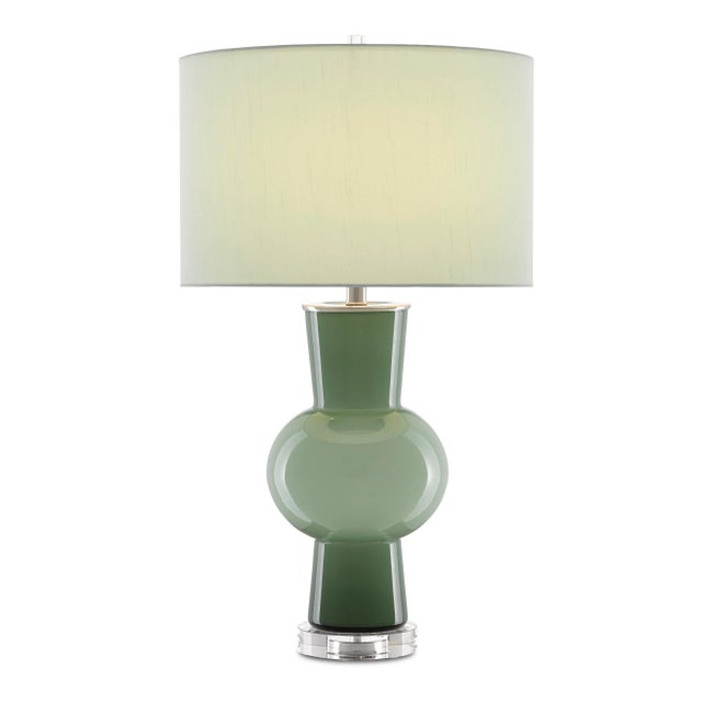 The Duende Green Table Lamp is made of glass with an artful light and dark green surface. The clear optic crystal base...