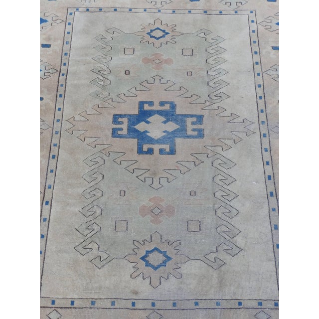 Beautiful hand-knotted wool in shades of neutral, teal and flesh tones form this beautiful Oushak rug. The soft colors are...