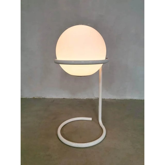 One of a kind, this special vintage desgin floor lamp in the shape of a the earth. This white glass Globe has a separate...