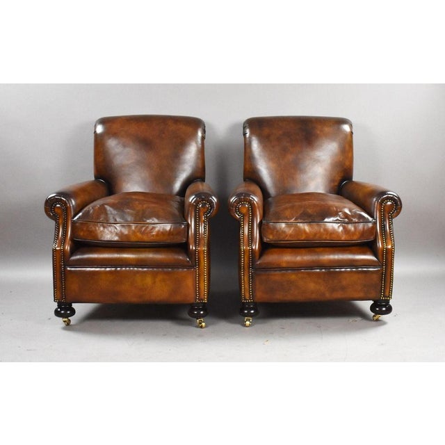 Pair of Leather Club Armchairs Item Code: LC18 A handsome pair of traditional leather club armchairs, upholstered in...