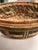 Beautiful earth toned basket, hand woven, from Africa. Geometric patterns in brown, orange and turquoise. Hold towels in...