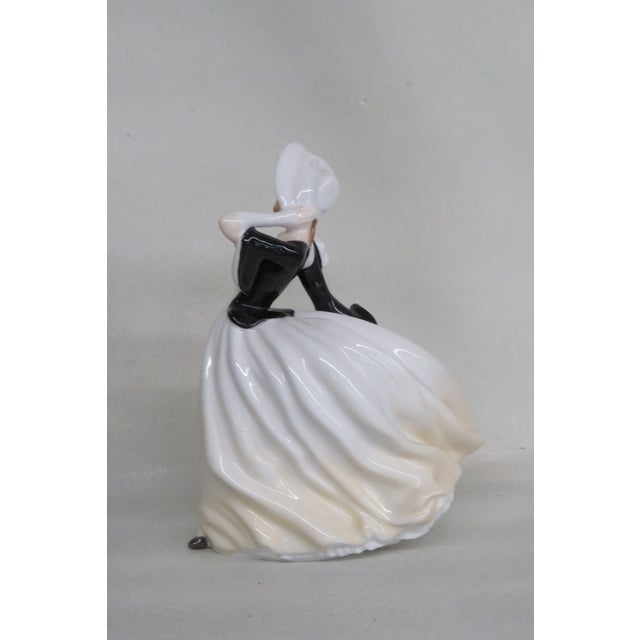 This gorgeous figurine is made of bone china / porcelain. This lovely collectible is stamped as having been made in...