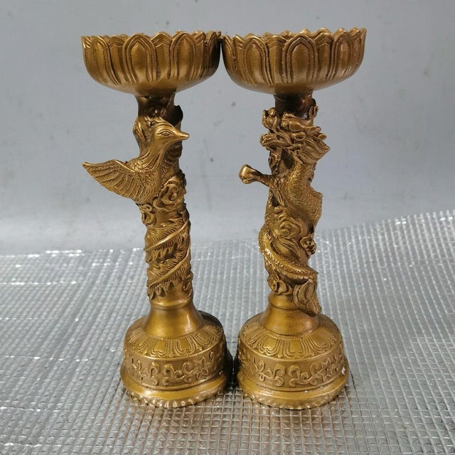 This exquisite pair of vintage Chinese candlesticks is crafted from gilt bronze, featuring a rich, warm gold finish with a...