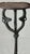 A sculptural wrought iron plant stand attributed to Samuel Yellin, showing the forge vocabulary and hand-worked detailing...