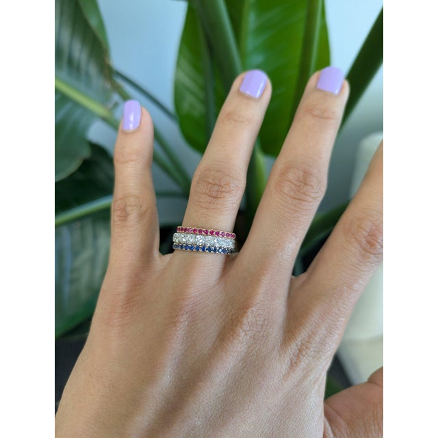 Sixteen rubies glow in warm, saturated red across this solid 14K yellow gold band. Ruby's rich color and exceptional...