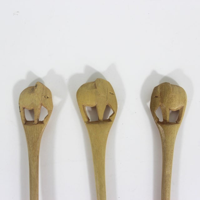 Set of three hand carved wood elephant safari animal condiment or sugar spoons. Excellent condition. 7” long You can find...